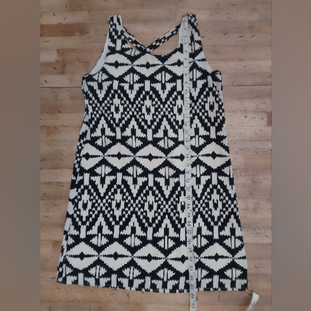 Black & White Patterned Top with Birdcage Logo Anthropologie